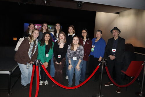 ASJA President Darcy Lewis with Fordham students at 2025 conference