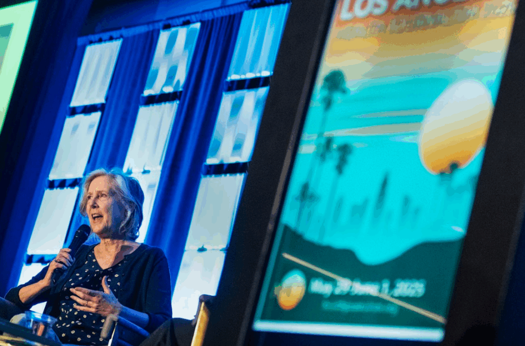 Bestselling author Mary Roach speaking at the Association of Health Care Journalist's 2025 conference (photo courtesy AHCJ)