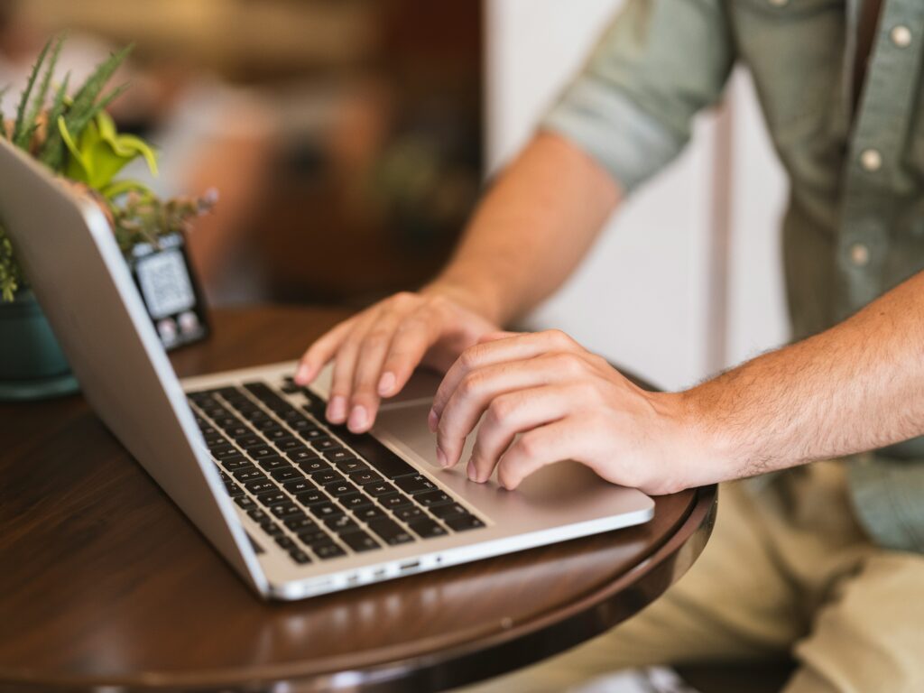 Man typing on laptop Unsplash